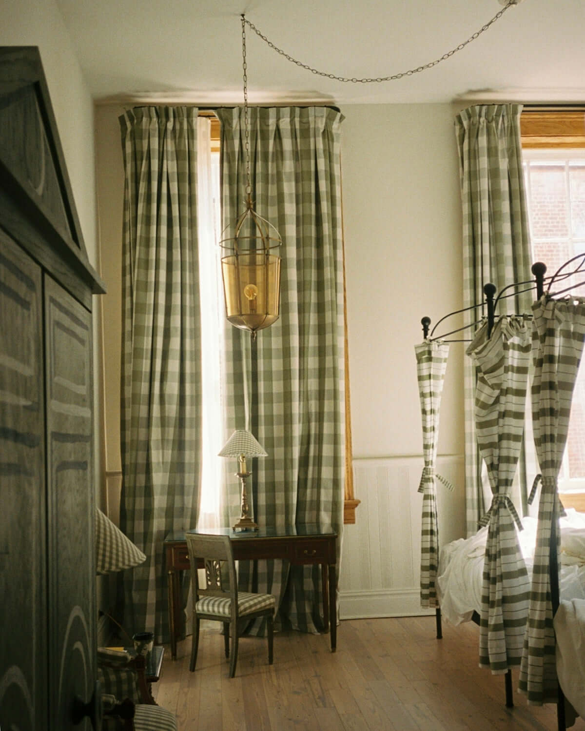 brown wooden side table near curtain